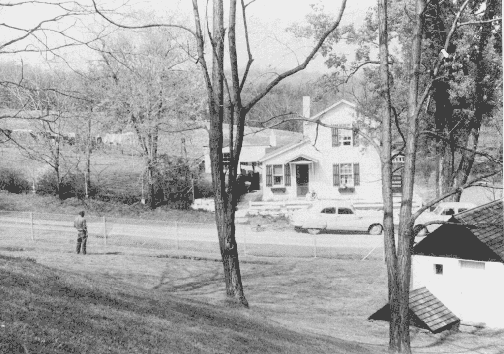 Tenant house from below front porch of main house, with Col. Winfield R. McKay, husband of Jean Plummer, May 10, 1958 (photograph by Richard Plummer)